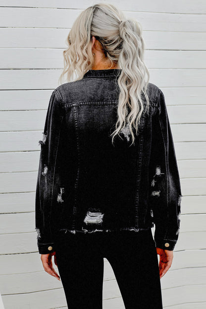 Black distressed raw hem denim jacket with button closures from Trendsi, showcasing a trendy, casual style.