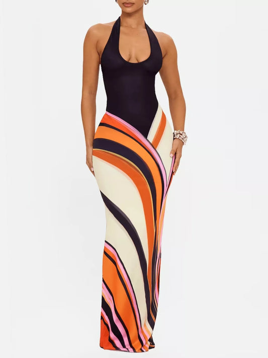 Black halter neck maxi dress with abstract print from Trendsi, flowing fabric and stylish design perfect for summer or evening wear.
