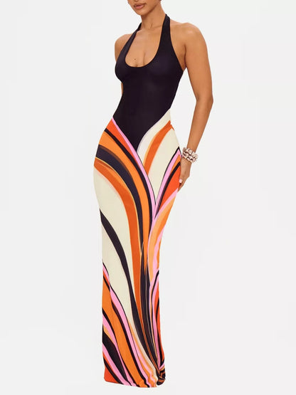 Black halter neck maxi dress with abstract print from Trendsi, flowing silhouette and stylish design.