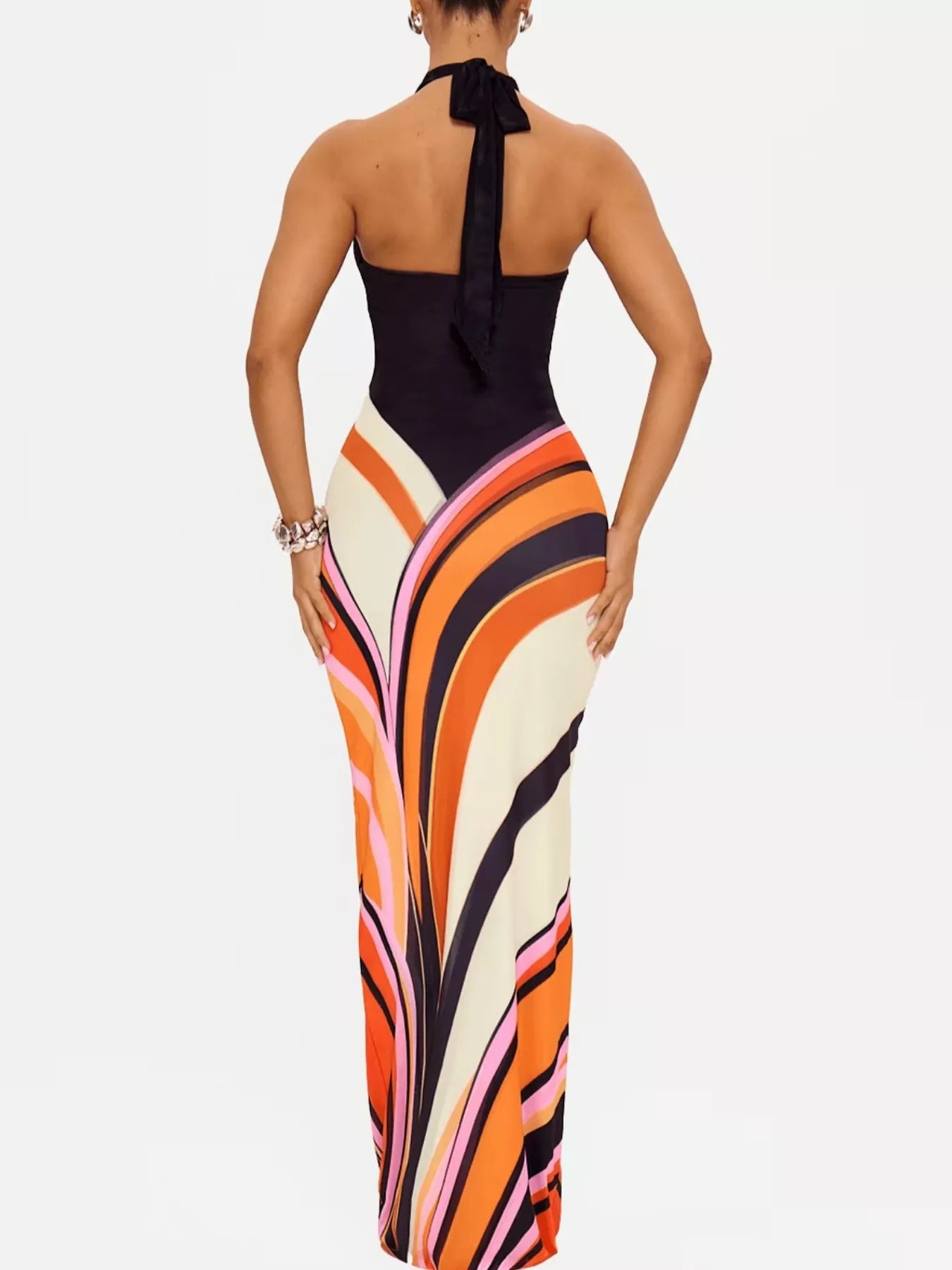 Black halter neck maxi dress with abstract print by Trendsi, featuring flowing fabric and stylish design.