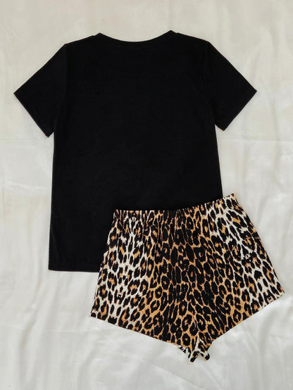 Black leopard print lounge set by Trendsi featuring a comfortable, stylish matching top and pants for relaxed, chic style.