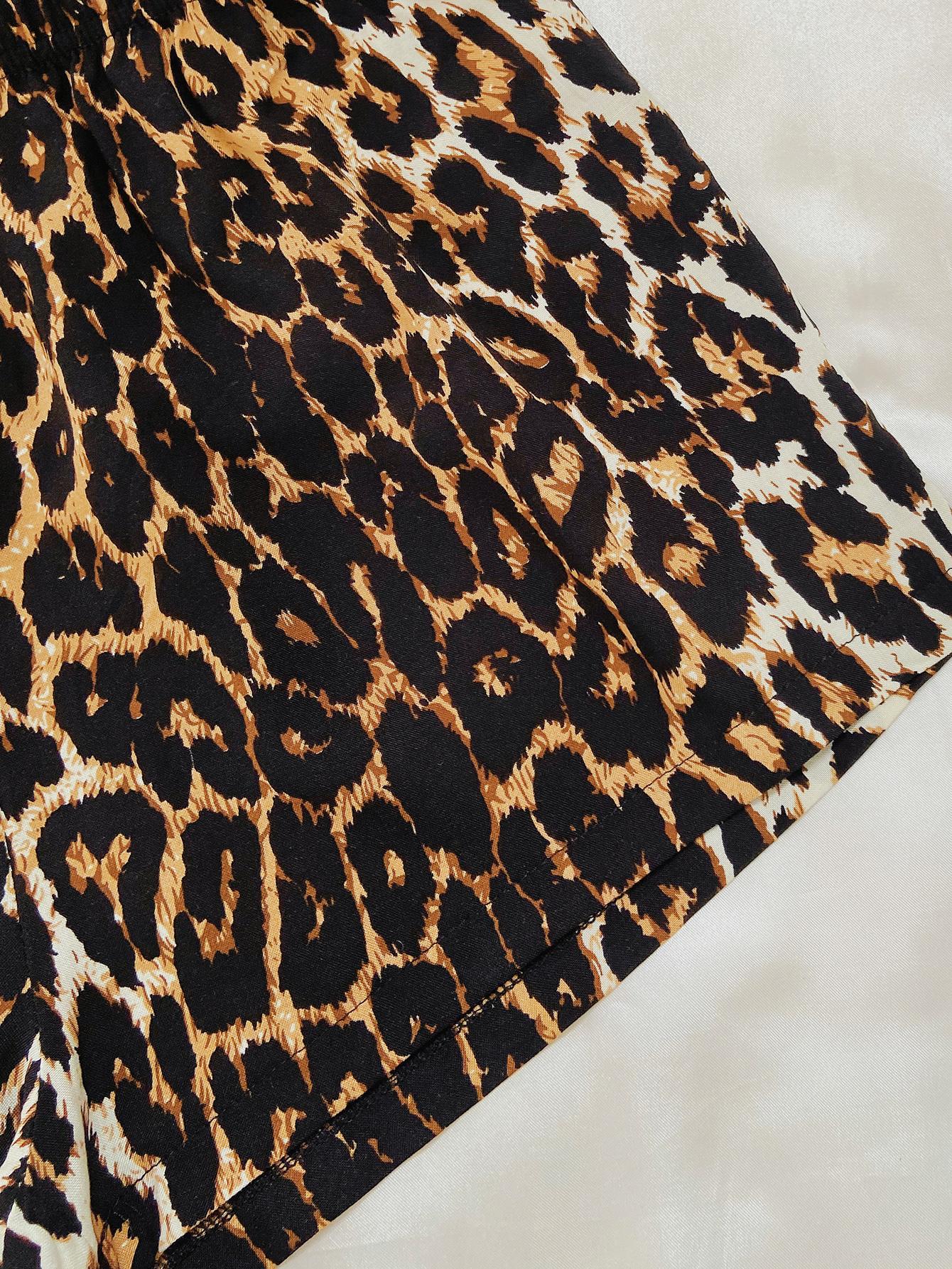 Black leopard print lounge set by Trendsi featuring comfortable fabric and chic style, perfect for relaxed, stylish lounging.