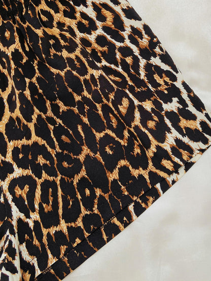Black leopard print lounge set by Trendsi featuring comfortable fabric and chic style, perfect for relaxed, stylish lounging.