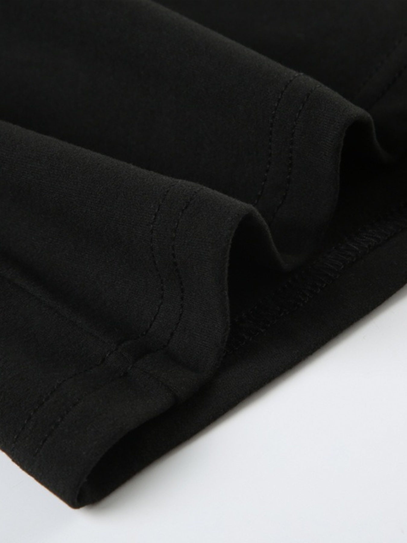 Black long sleeve ruched active romper by Trendsi, featuring a fitted design and comfortable stretch fabric.