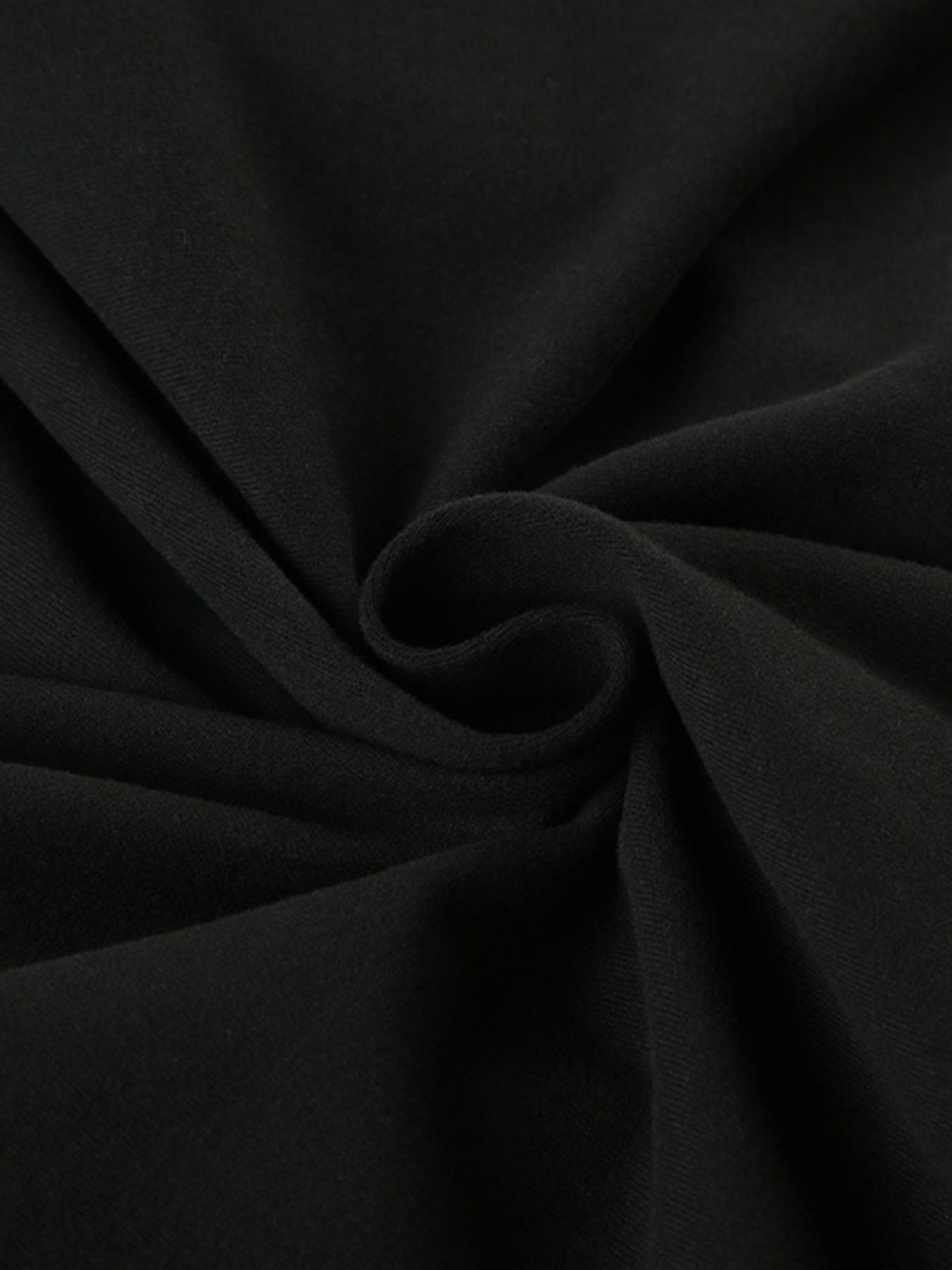 Black long sleeve ruched active romper by Trendsi, featuring a fitted design and stretchy fabric for comfortable movement.