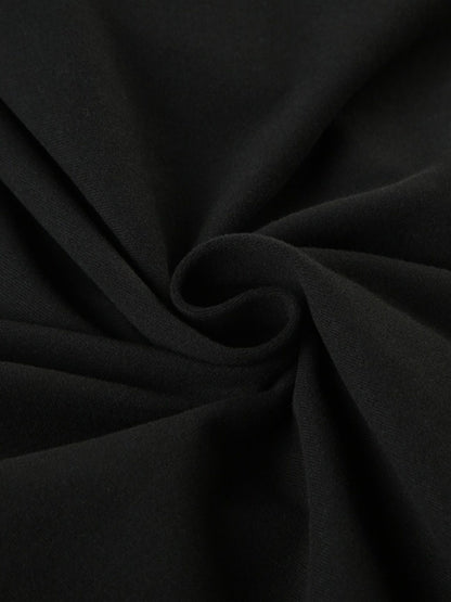 Black long sleeve ruched active romper by Trendsi, featuring a fitted design and stretchy fabric for comfortable movement.