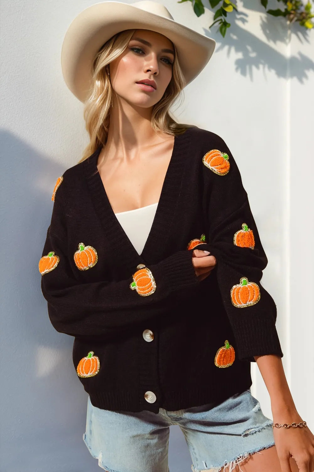 Full view of Trendsi Double Take Pumpkin Button Up Long Sleeve Cardigan showing its cozy knit fabric and classic pumpkin color.