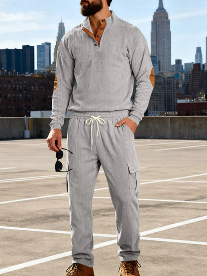 Plus size men's casual black button-detail top and pants set by Trendsi, featuring a relaxed fit and comfortable style.