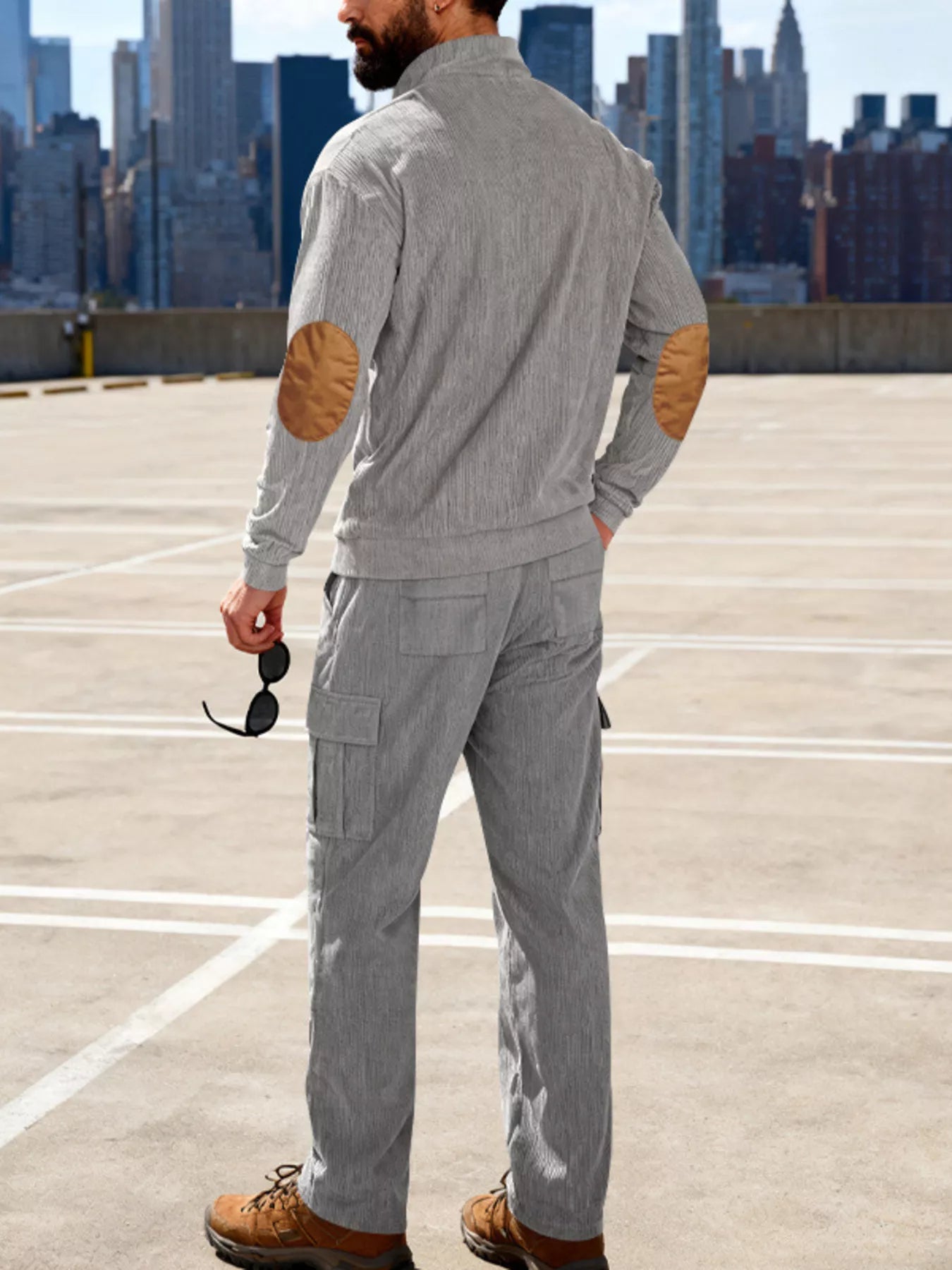 Plus size men's casual black button detail top and pants set by Trendsi, featuring a comfortable, relaxed fit.