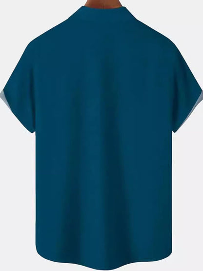 Men's plus size color block short sleeve shirt by Trendsi, featuring bold black and contrasting color blocks, casual fit.
