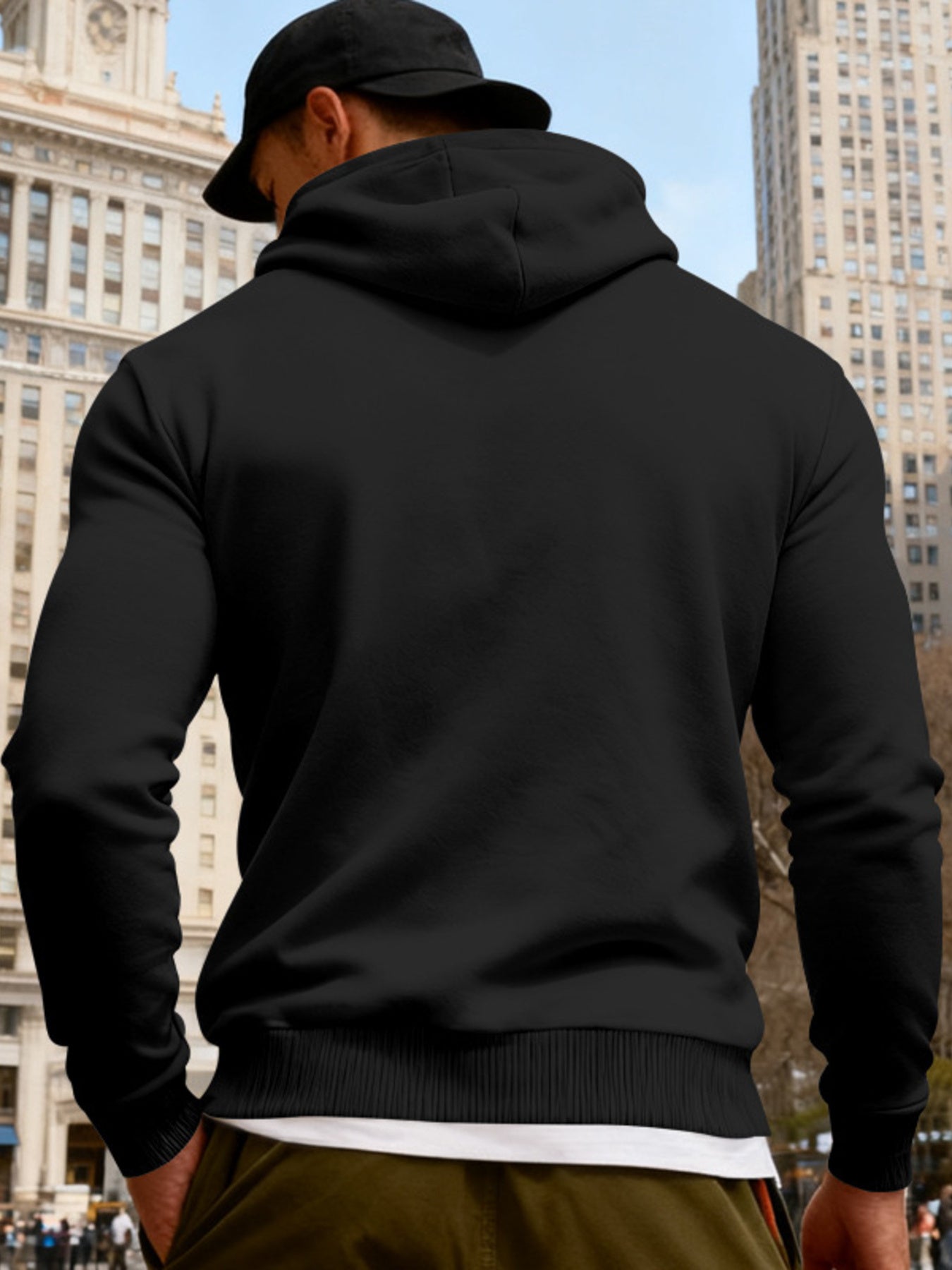 Men's black full-size fleece hoodie with dual chest pockets, plus size, from Trendsi, featuring a cozy, relaxed fit.