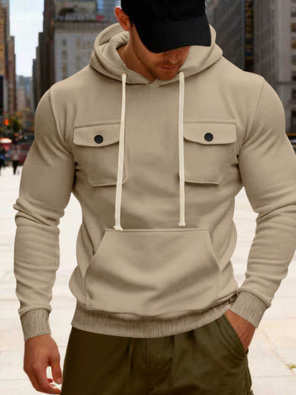 Men's black full-size fleece hoodie with dual chest pockets, plus size, from Trendsi, shown on a model.