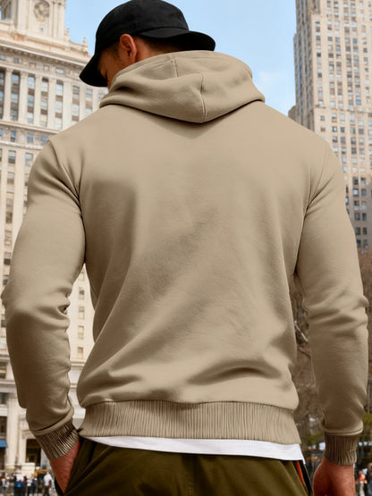 Men's black full-size fleece hoodie with dual chest pockets, from Trendsi, featuring a soft, cozy fabric and a comfortable fit.