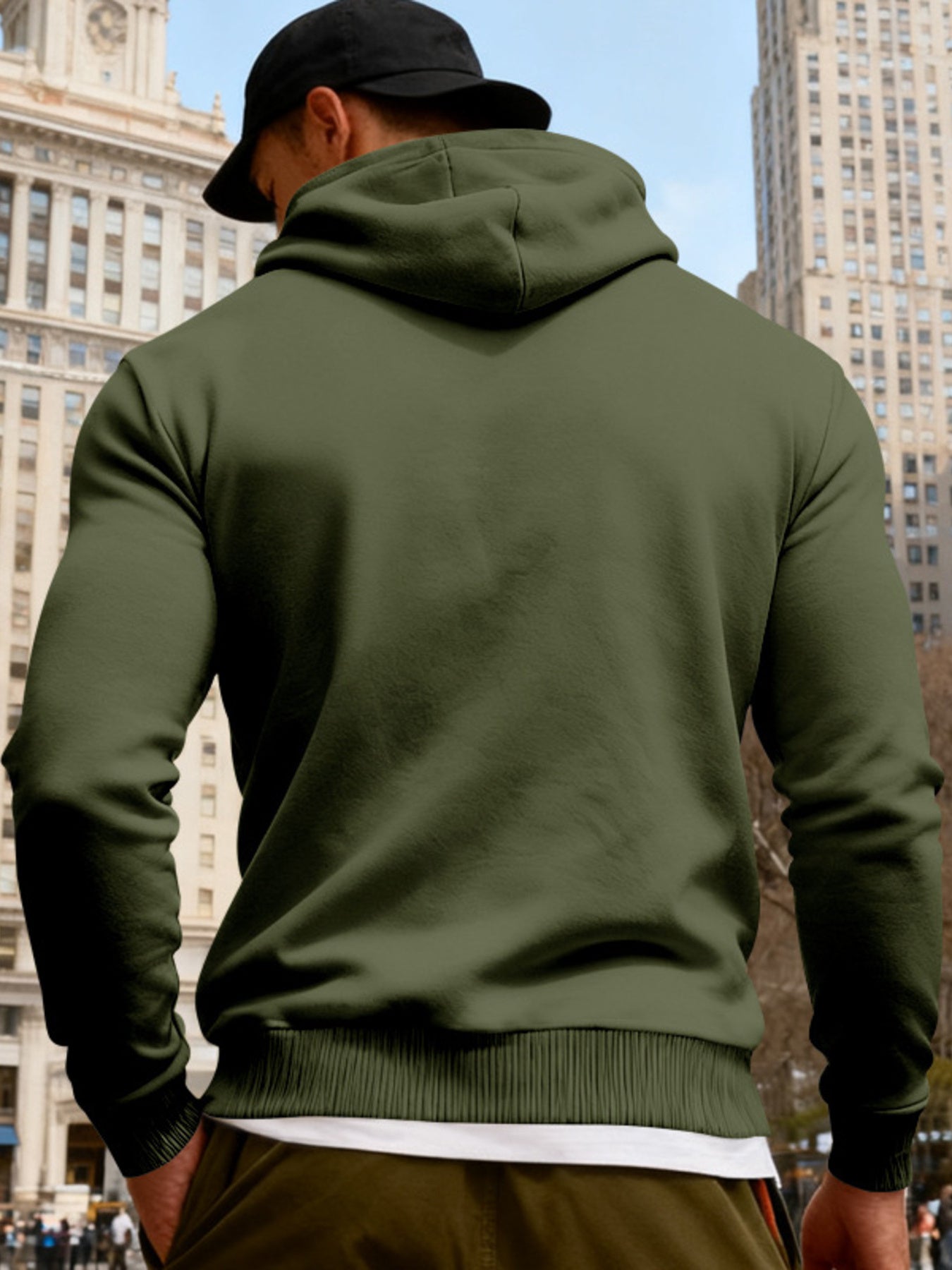 Black men's full-size fleece hoodie with dual chest pockets, featuring a comfortable fit and trendy style by Trendsi.