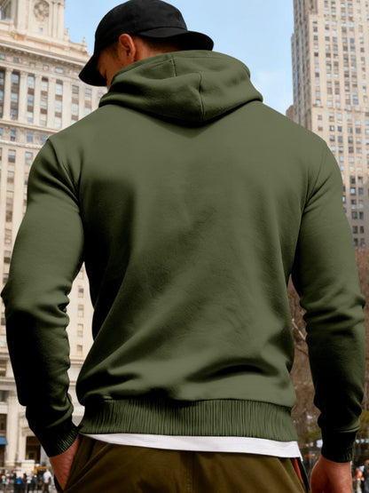 Black men's full-size fleece hoodie with dual chest pockets, featuring a comfortable fit and trendy style by Trendsi.