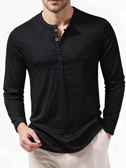 Men's black long sleeve Henley T-shirt from Trendsi, showcasing a fitted style with buttoned neckline and soft fabric.