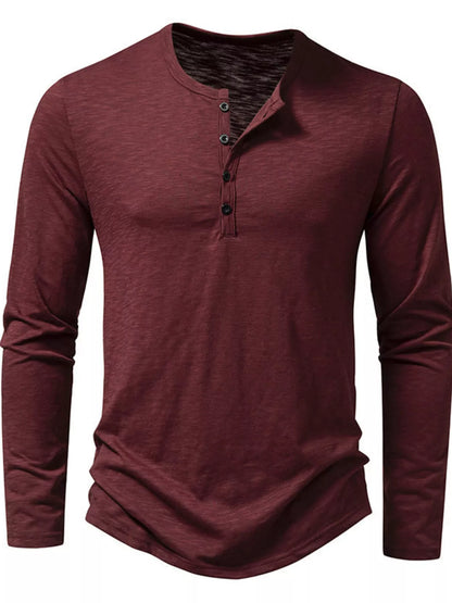 Black men's long sleeve Henley T-shirt by Trendsi, featuring a buttoned placket and soft cotton fabric.
