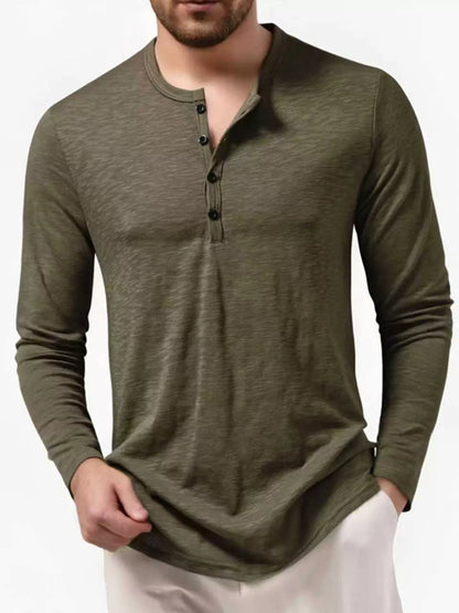 Men's black long sleeve Henley T-shirt from Trendsi, featuring a classic round neckline and buttoned placket.