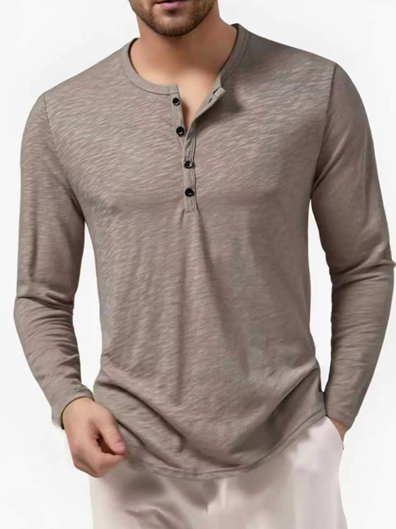 Men's black long sleeve Henley T-shirt from Trendsi, featuring a classic crew neckline and buttoned placket.