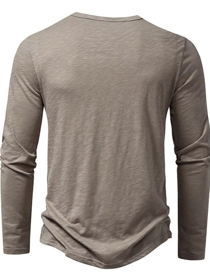 Black men's long sleeve Henley T-shirt from Trendsi, featuring a buttoned neckline and casual fit.