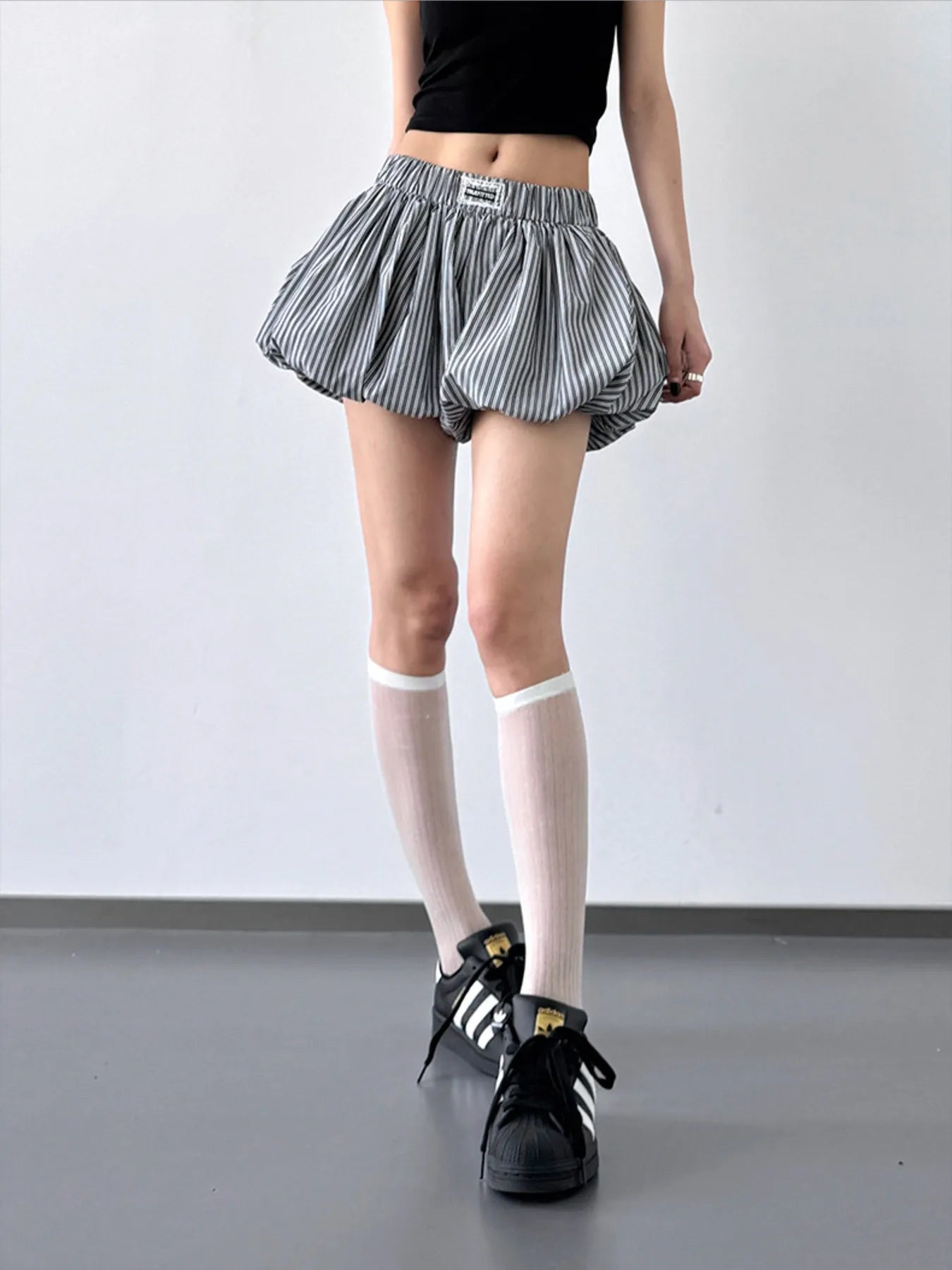 Striped bubble hem casual shorts by Trendsi featuring vertical stripes and a relaxed fit perfect for summer wear.