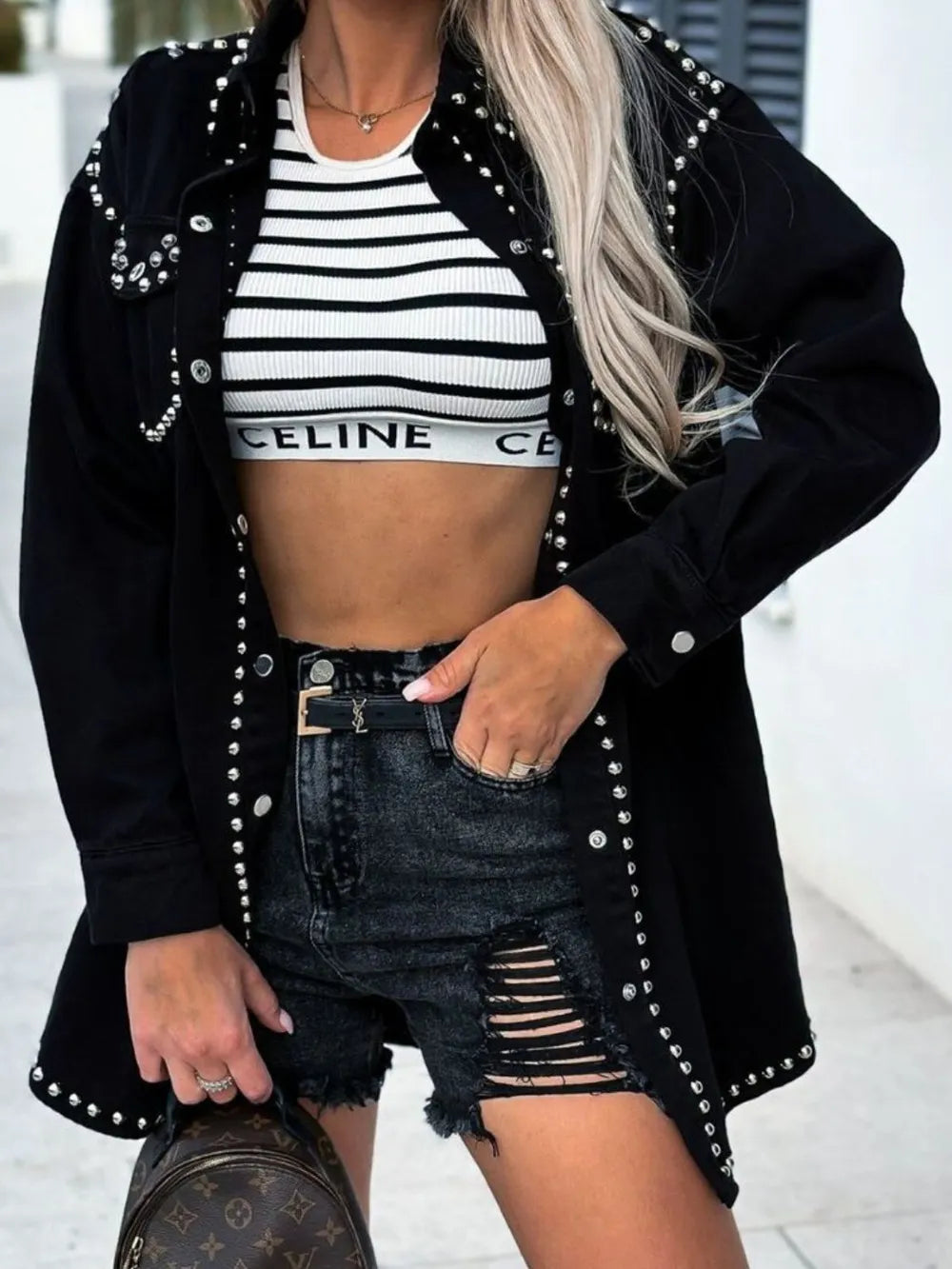 Black studded snap-down long sleeve denim shacket with collar and button details, styled for casual wear.