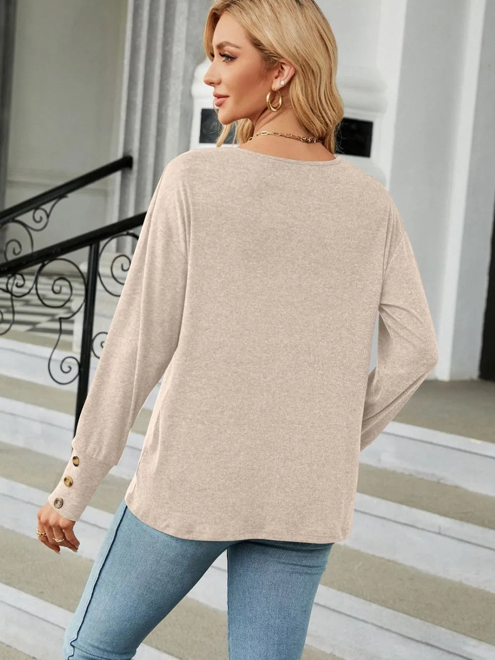 Black V-neck long sleeve T-shirt from Trendsi featuring a comfortable fit and soft fabric, perfect for casual wear.