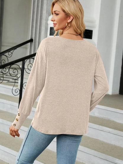 Black V-neck long sleeve T-shirt from Trendsi featuring a comfortable fit and soft fabric, perfect for casual wear.