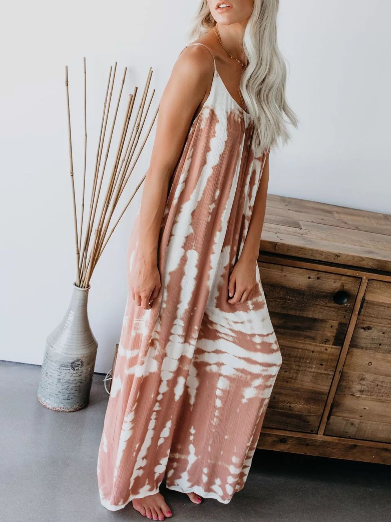 Plus size tie-dye wide leg jumpsuit by Trendsi, featuring a full-length, vibrant blue tie-dye pattern and comfortable wide-leg design.