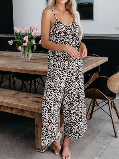 Plus size tie-dye wide leg jumpsuit from Trendsi, featuring vibrant blue colors and a full-length, relaxed fit.