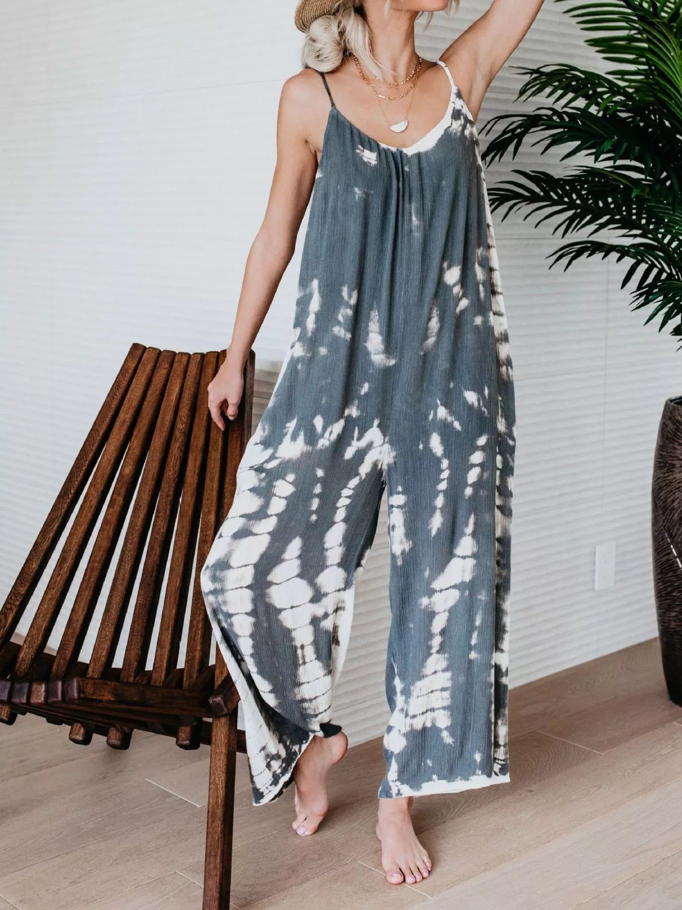 Plus size tie-dye wide-leg jumpsuit by Trendsi, full size, featuring vibrant blue tie-dye pattern and relaxed fit.