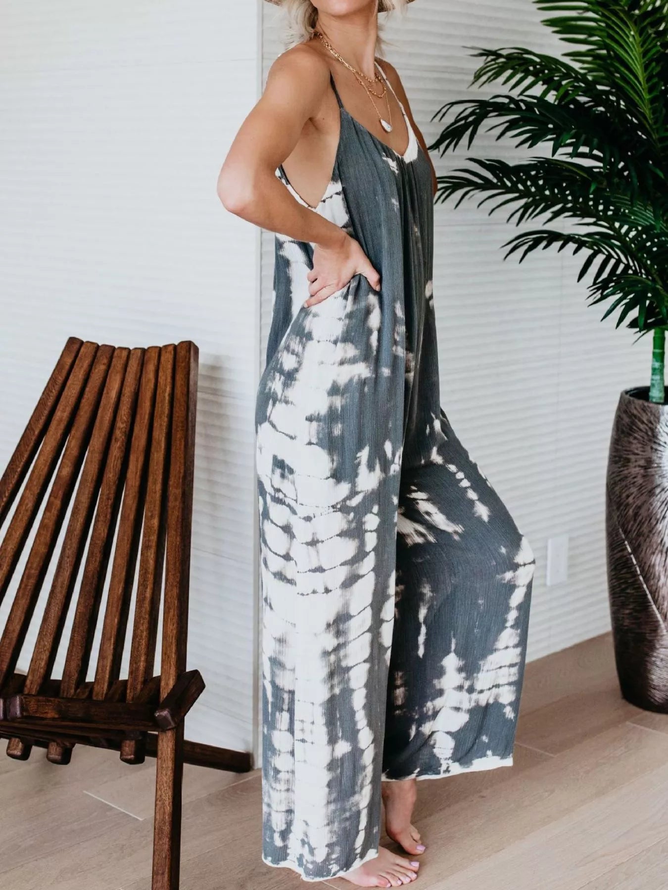 Plus size blue tie-dye wide leg jumpsuit by Trendsi, full-length view showing relaxed fit and vibrant pattern.