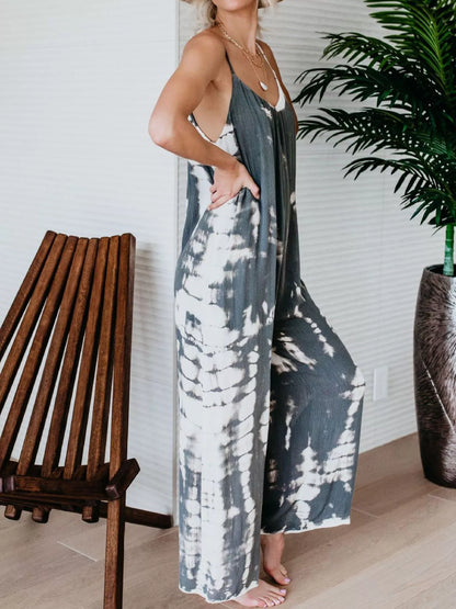 Plus size blue tie-dye wide leg jumpsuit by Trendsi, full-length view showing relaxed fit and vibrant pattern.