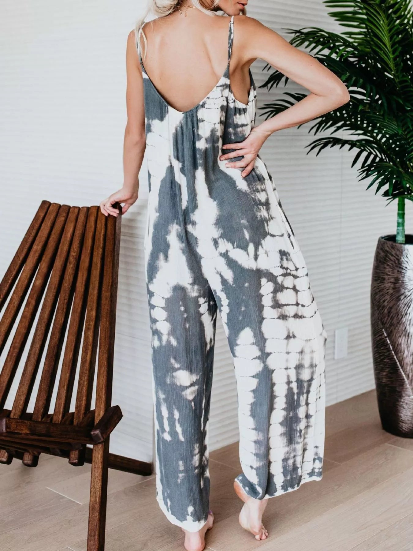 Plus size tie-dye wide-leg jumpsuit by Trendsi, full length with vibrant blue and colorful pattern, casual and comfortable style