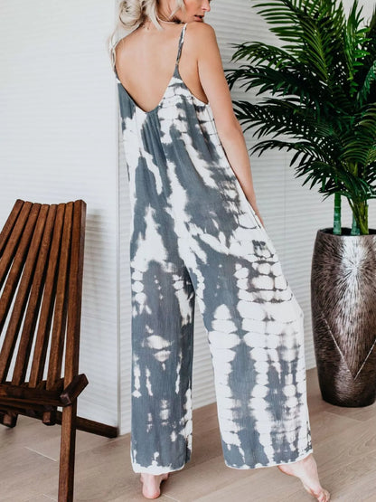Plus size blue tie-dye wide leg jumpsuit from Trendsi, full-length casual jumpsuit with relaxed fit and stylish pattern.