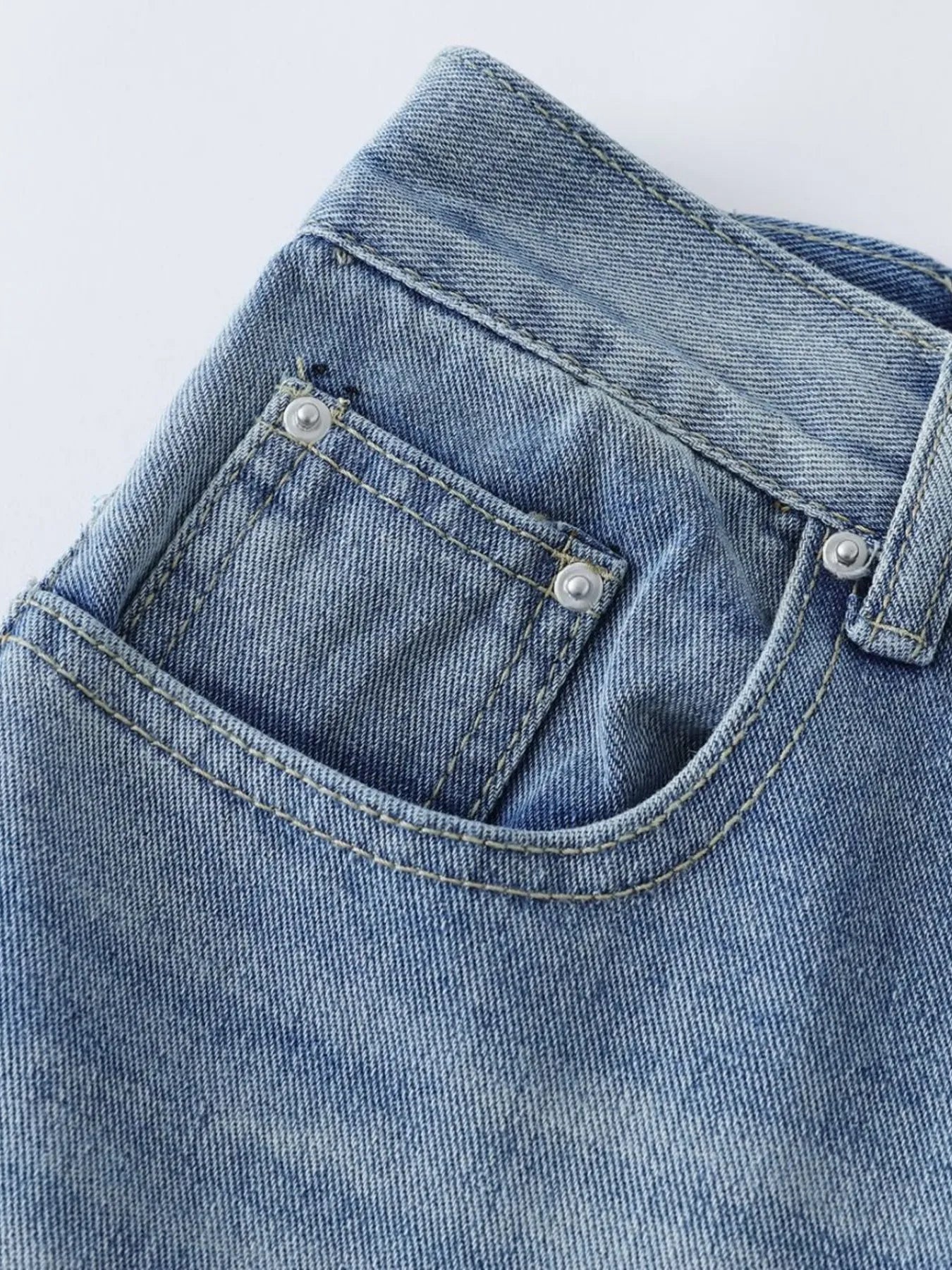 Men's blue high-waist wide-leg relaxed fit jeans from Trendsi, showcasing the stylish denim with a comfortable fit.