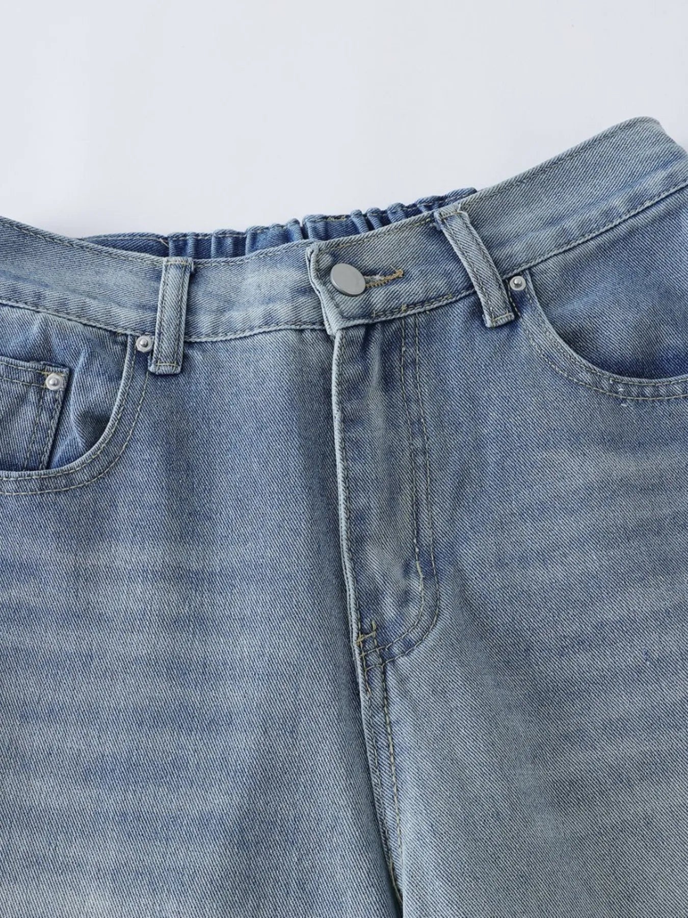 Men's high-waist wide-leg relaxed fit jeans in blue denim by Trendsi, shown on a model, with front and back views.