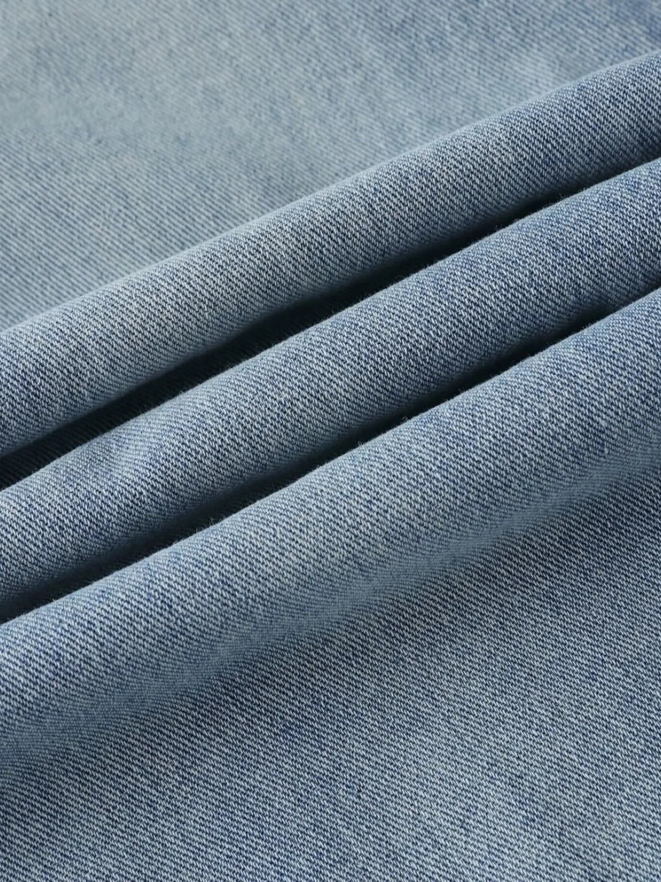 Men's high-waist wide-leg relaxed fit jeans in blue denim, shown from the front with pockets and belt loops.