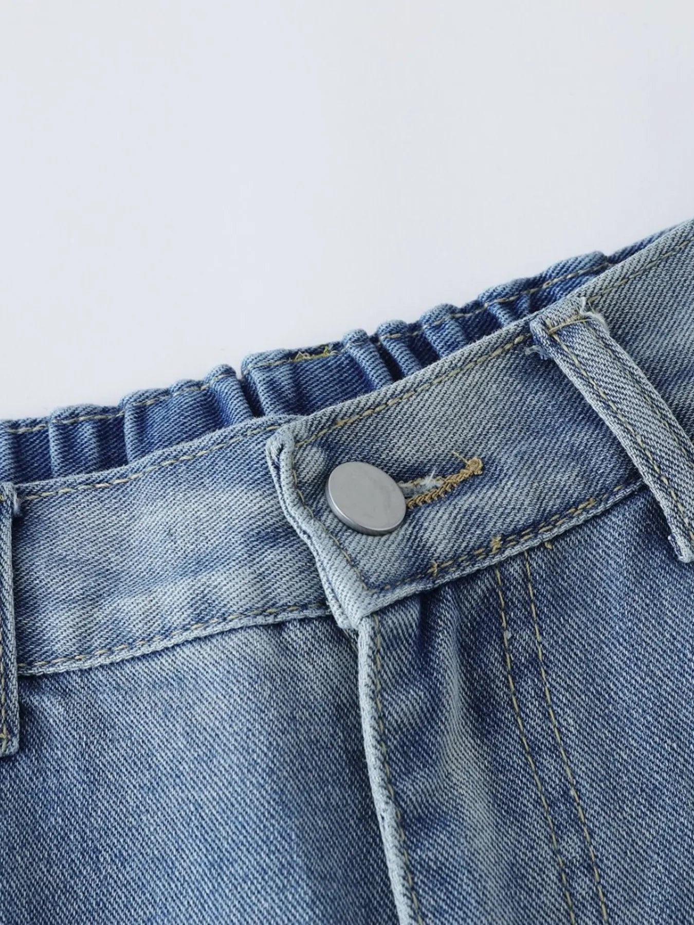 Men's high-waist wide-leg relaxed fit jeans in blue denim, stylish and comfortable for casual wear by Trendsi.