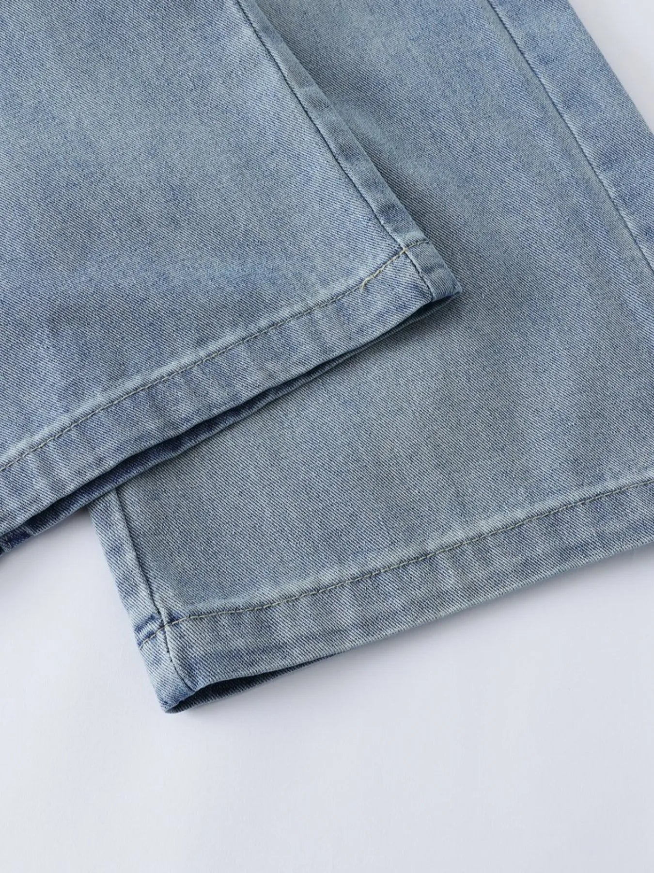 Men's blue high-waist wide-leg relaxed fit jeans by Trendsi, showcasing the stylish cut and comfortable fit.