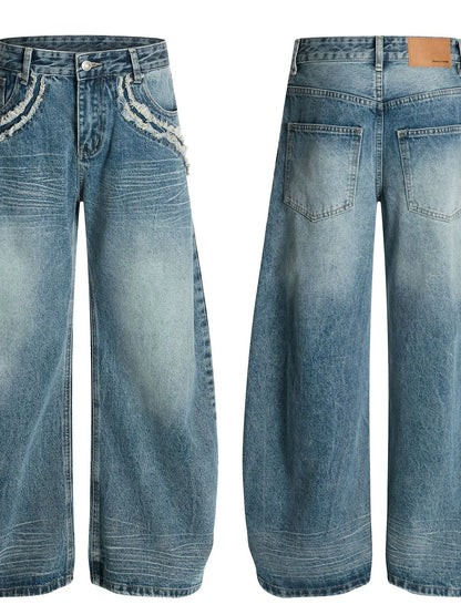 Men's wide-leg vintage wash jeans by Trendsi, showing relaxed fit and faded denim fabric with classic stitching details.