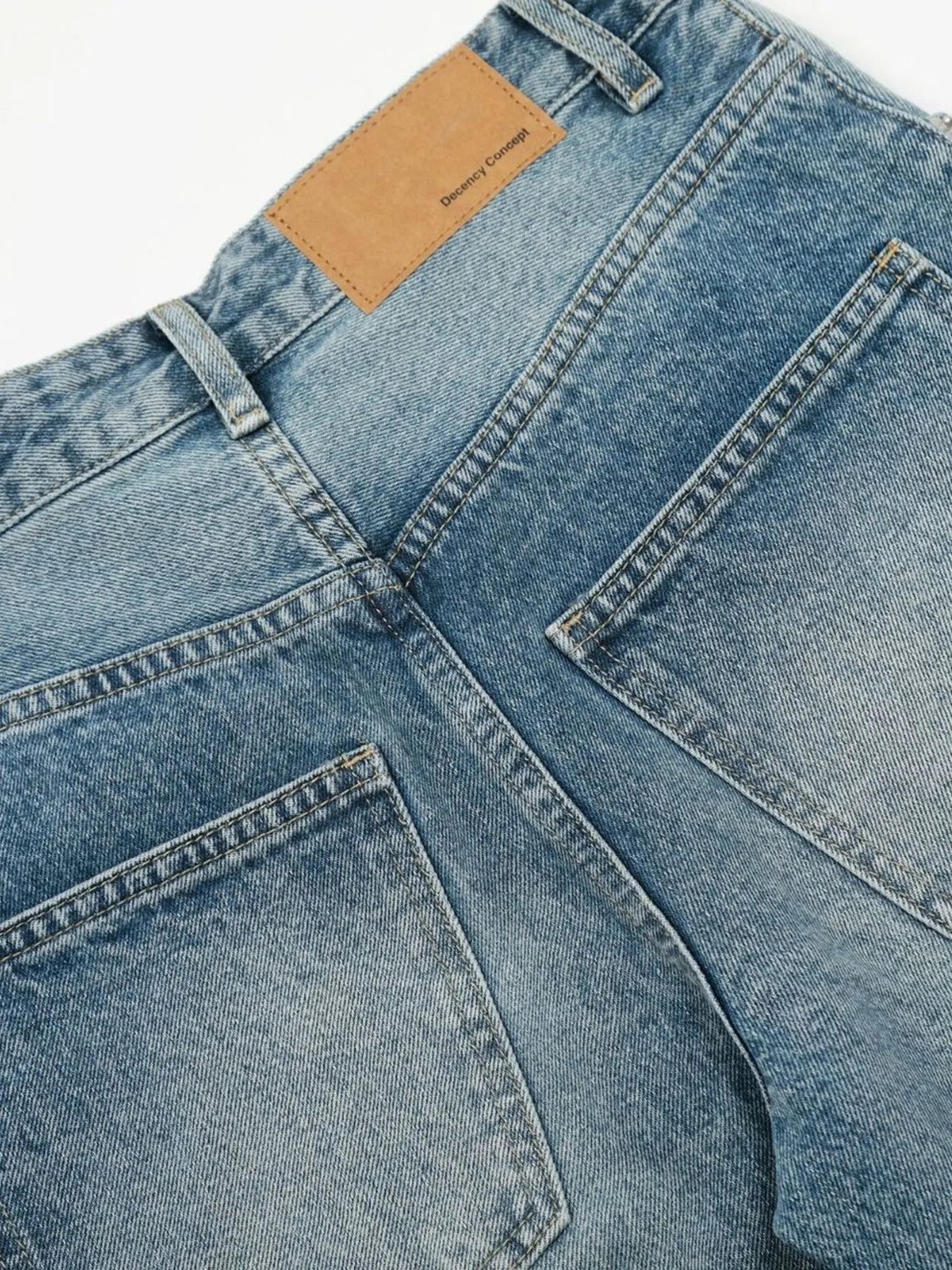 Men's wide-leg vintage wash jeans from Trendsi, showing relaxed fit and classic denim texture in a high-quality image.