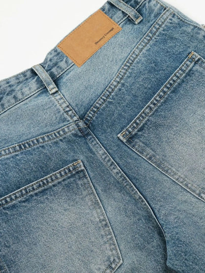 Men's wide-leg vintage wash jeans from Trendsi, showing relaxed fit and classic denim texture in a high-quality image.