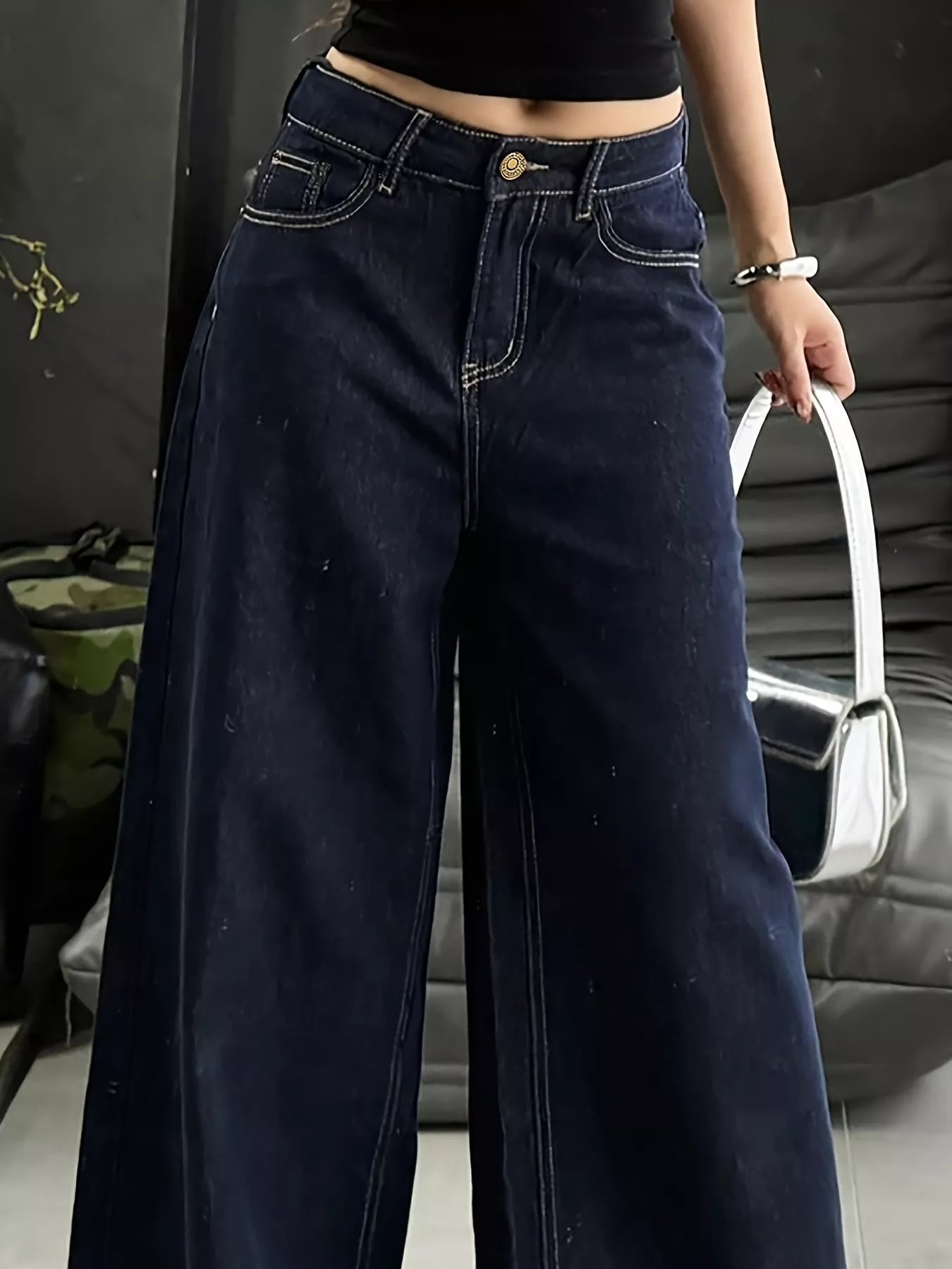 Blue wide-leg jeans by Trendsi, featuring a relaxed fit, high waist, and classic denim style, shown on a model.