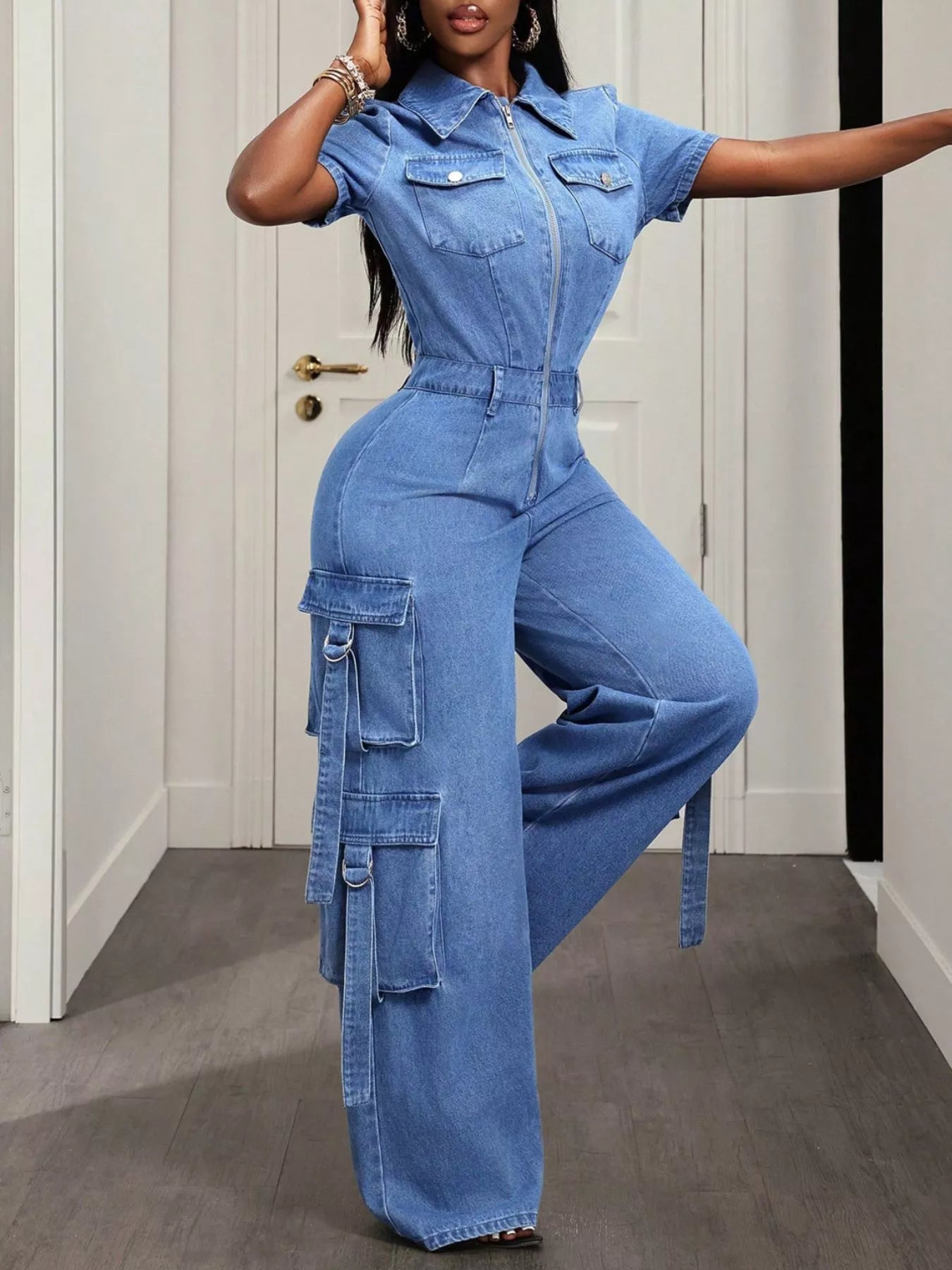 Light blue zip front short sleeve denim jumpsuit by Trendsi, featuring a fitted waist and casual style for women.