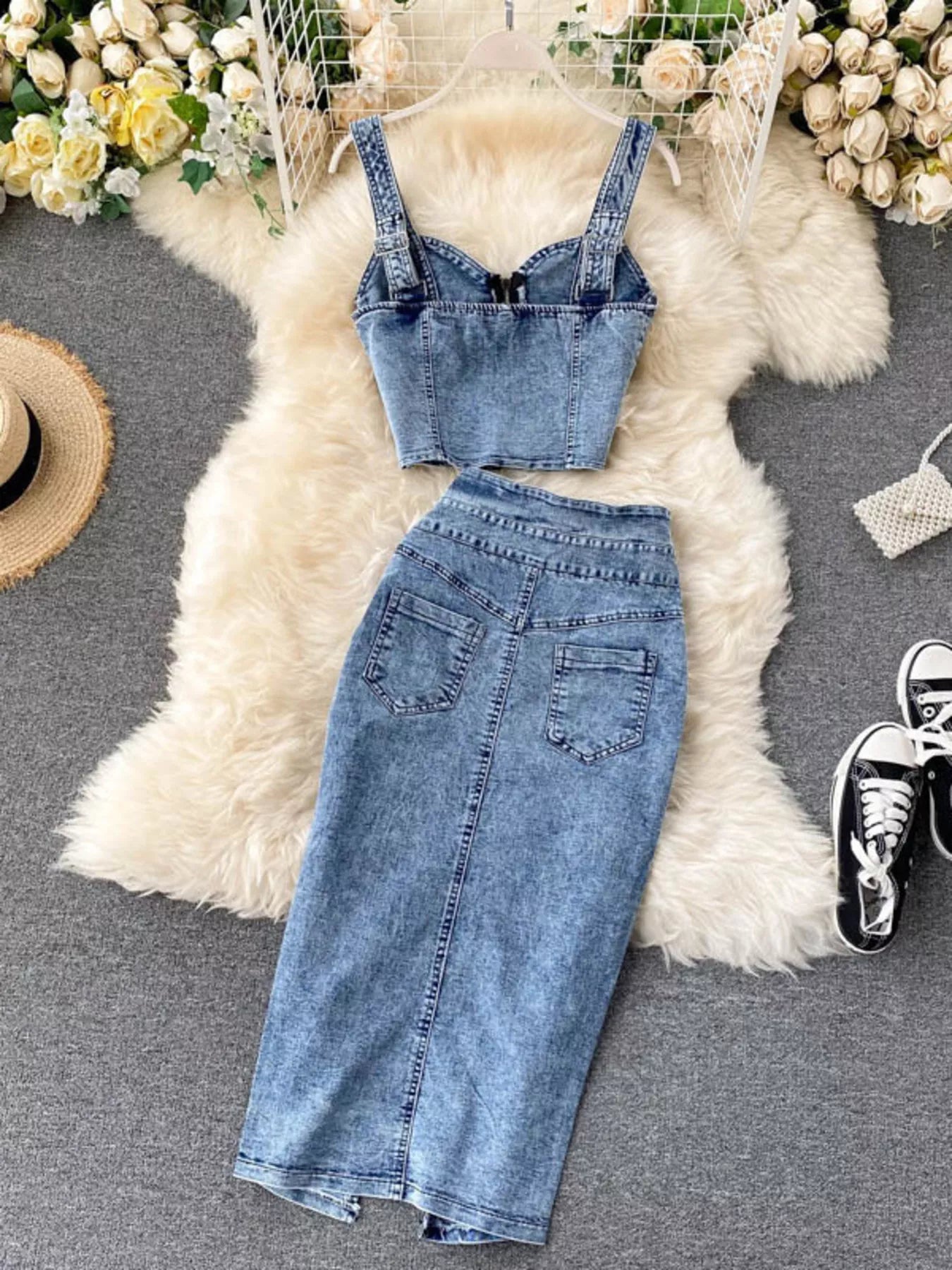Trendsi denim skirt set with a zipper top and button slit skirt, featuring a stylish, fitted design and classic denim fabric.
