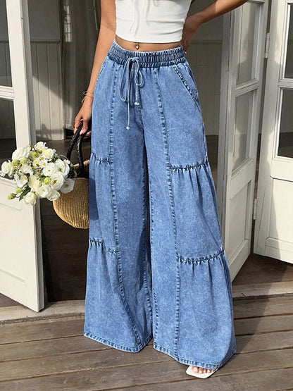Wide leg tiered jeans from Trendsi featuring a relaxed fit, tiered design, and light denim wash.