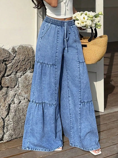 Wide leg tiered jeans from Trendsi featuring a relaxed fit, tiered design, and a stylish casual look.