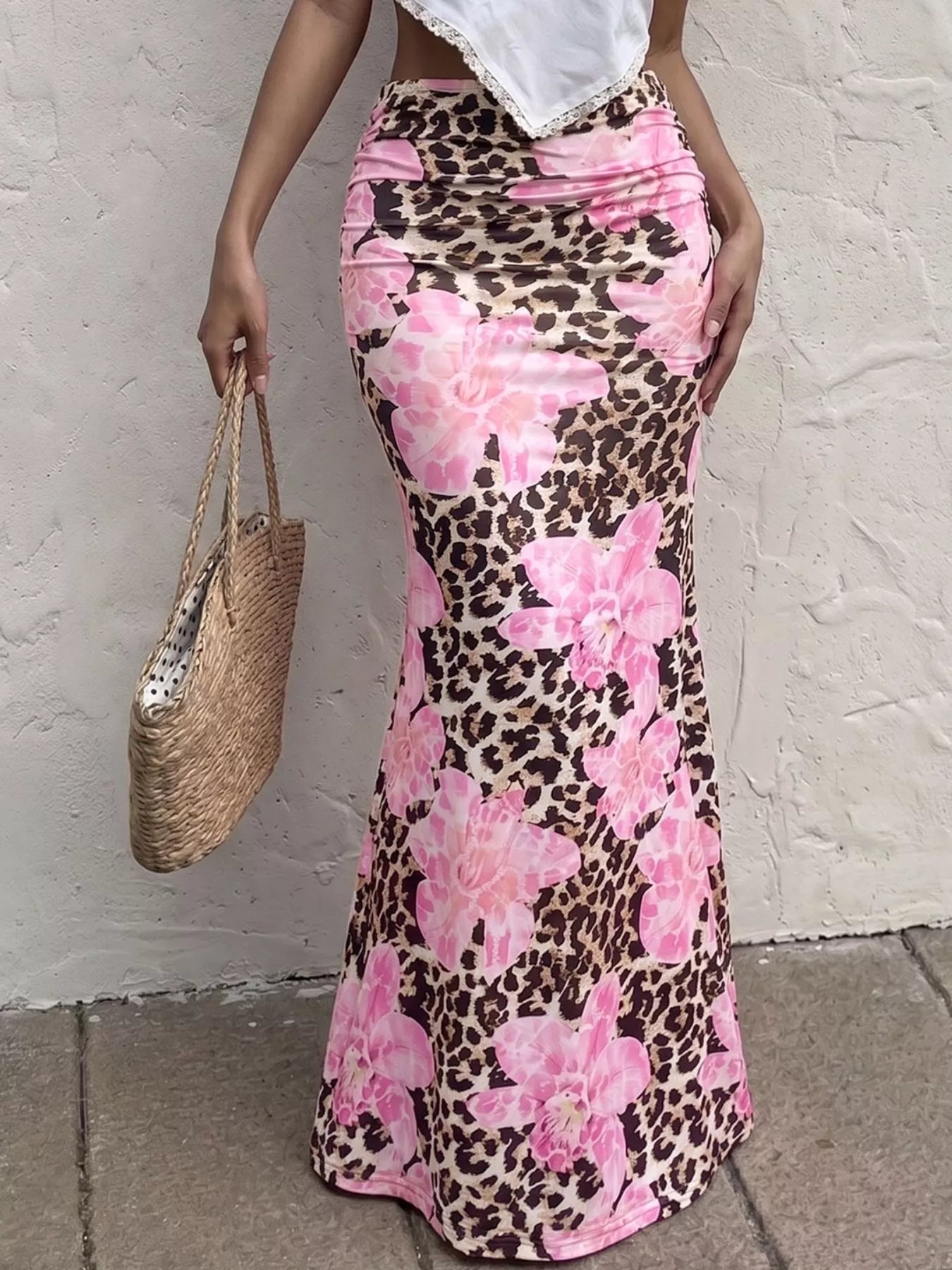 Blush pink leopard print bodycon maxi skirt from Trendsi, featuring a fitted silhouette and bold animal pattern.