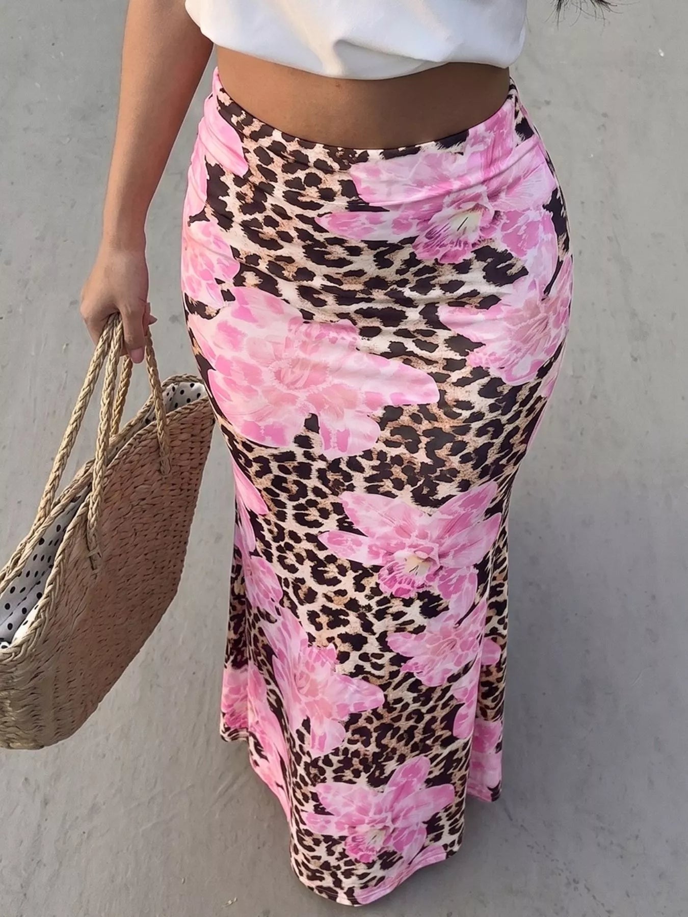 Blush pink leopard print bodycon maxi skirt from Trendsi, featuring a fitted silhouette and bold animal print design.